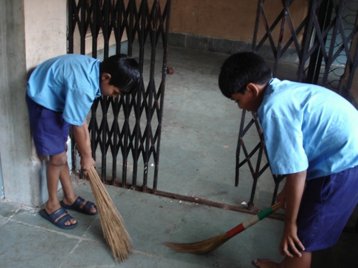 MCD Schools children sweeping floors