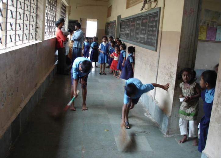 MCD Schools children sweeping floors