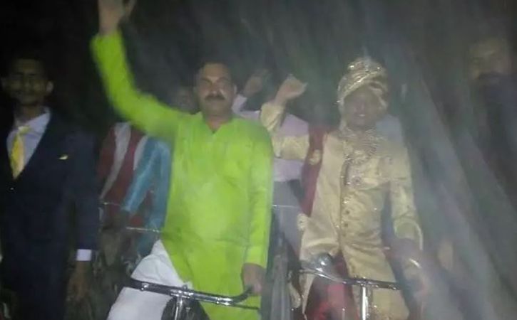 youth decided to ride a bicycle along with the baratis to his bride home