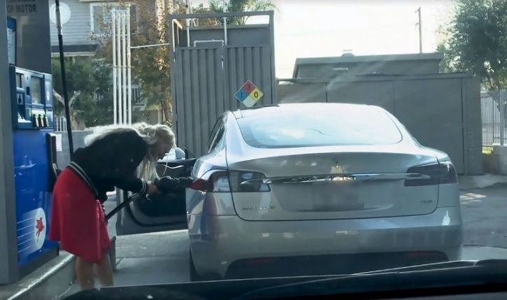 Tesla, Electric Vehicle, Electric Car, Tesla Gasoline, Woman Pouring Gas In Tesla, Technology News, 