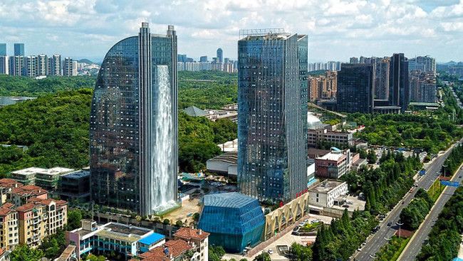 A Chinese skyscraper has an artificial waterfall that stands at a whopping 350 feet. The water casca