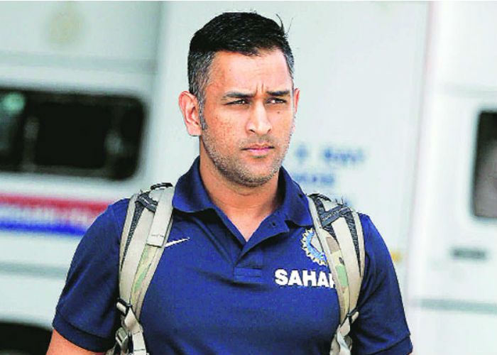 Indian cricketer Mahendra Singh Dhoni adjusts his hair as he watches  News Photo  Getty Images
