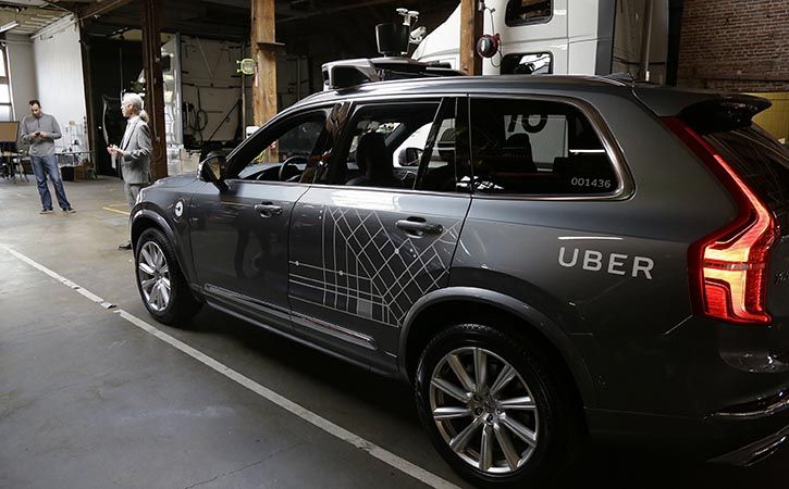 An Uber self-driving car hit and killed a woman crossing the street in Arizona, police said on Monda