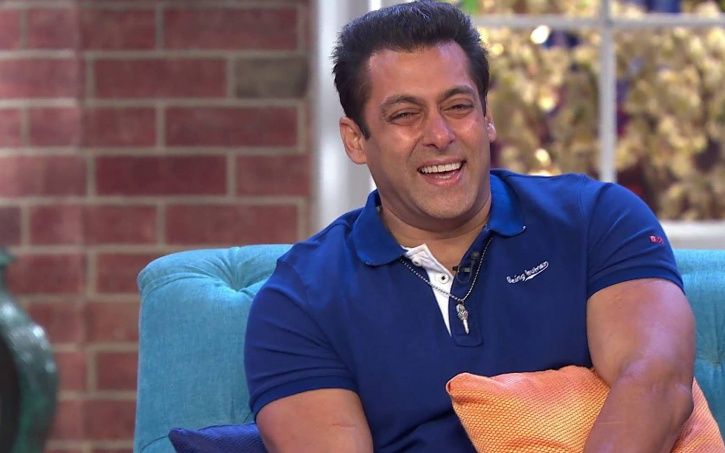 A picture of Salman Khan laughing uncontrolably.