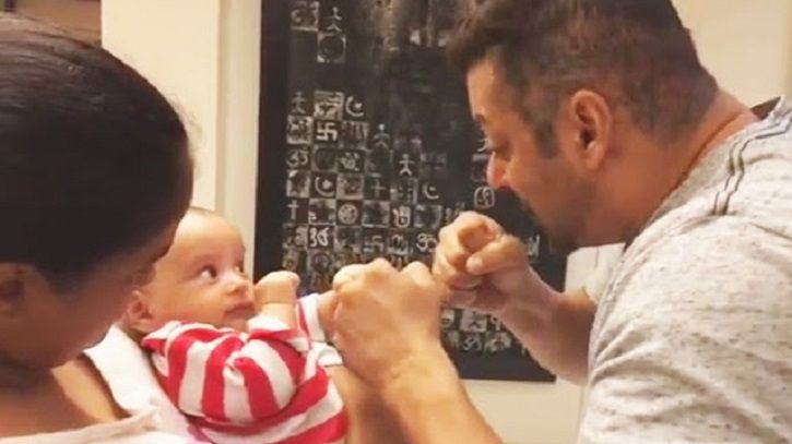 A picture of Salman Khan playing with his nephew Aahil.