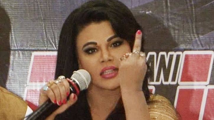 A picture of Rakhi Sawant showing her middle finger.