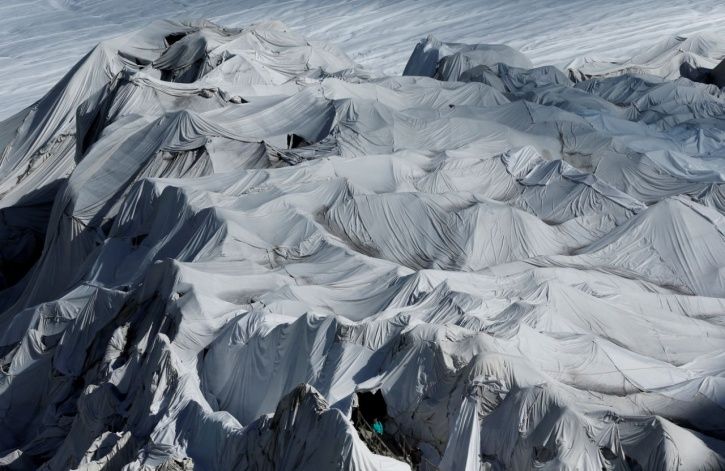 Massive blankets used to slow melting glacier