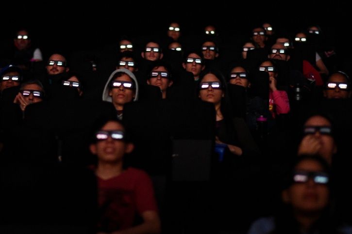 People watching Avengers Endgame in cinema halls.