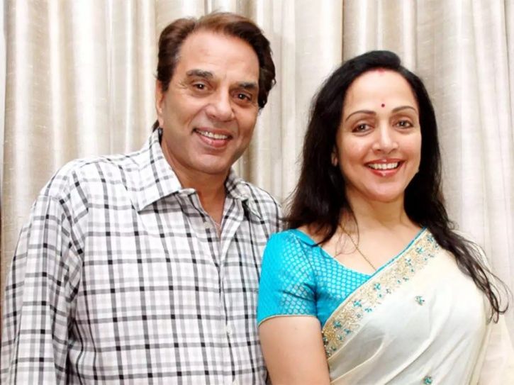 Dharmendra and Hema Malini after her sweeping act with a broom outside parliament.