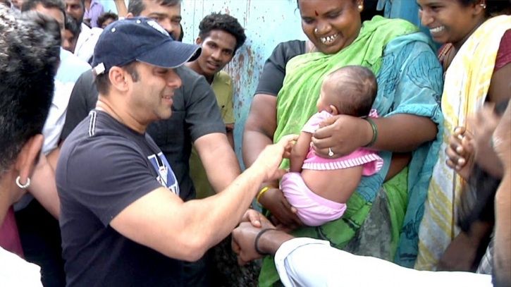 Salman Khan playing with a kid.