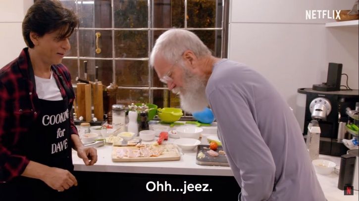 David Letterman is helping him by chopping veggies, he pretends to have cut his finger.