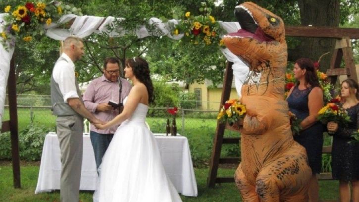 Maid of Honour arrived in T-rex costume.