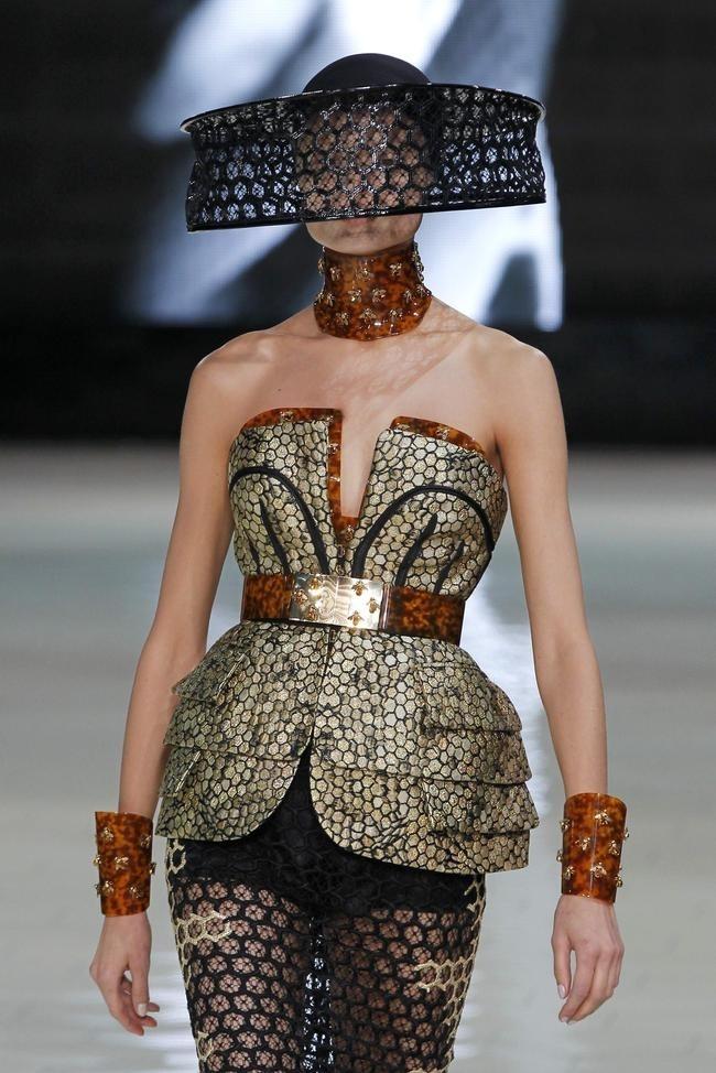 A model presents a creation by British fashion designer Alexander