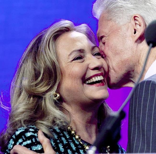 Bill and Hillary embrace each other onstage
