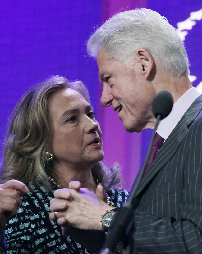 Bill and Hillary embrace each other onstage