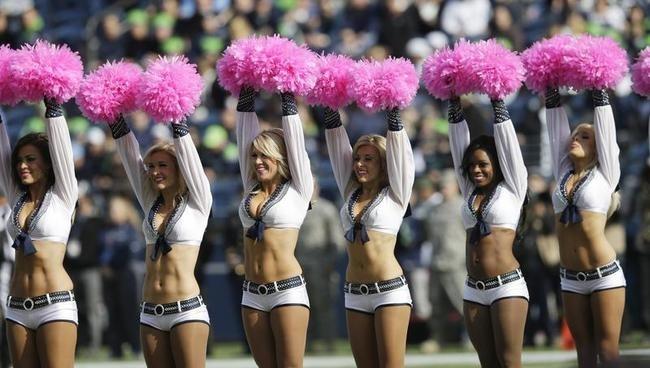 Seattle Seahawks cheerleaders pink pom,poms awareness.