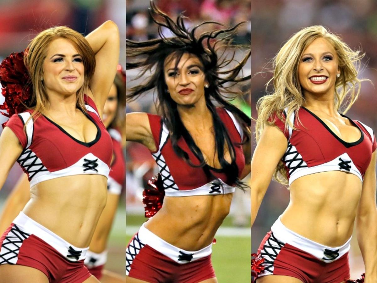 A Arizona Cardinals cheerleader performs against the Arizona