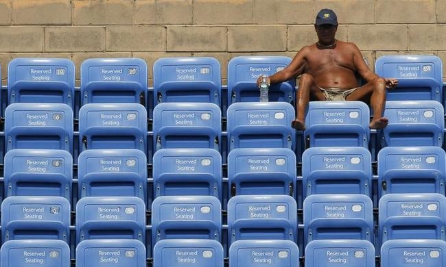 A tennis fan watches play at the 2014 U.S. Open tennis tournament in New York A tennis fan watches play at the 2014 U.S. Open tennis tournament in New York
