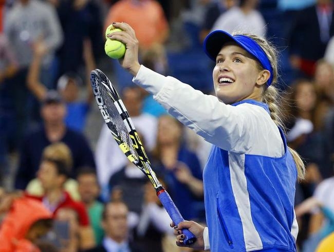 Bouchard of Canada celebrates by hitting balls into the crowd after defeating Cirstea of Romania during their women's singles match at the U.S. Open tennis tournament in New York Bouchard of Canada celebrates by hitting balls into the crowd after defeating Cirstea of Romania during their women's singles match at the U.S. Open tennis tournament in New York