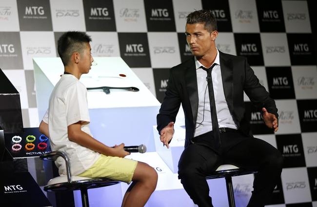 Real Madrid's soccer player Ronaldo talks with a Japanese fan during a promotional event in Tokyo Real Madrid's soccer player Ronaldo talks with a Japanese fan during a promotional event in Tokyo