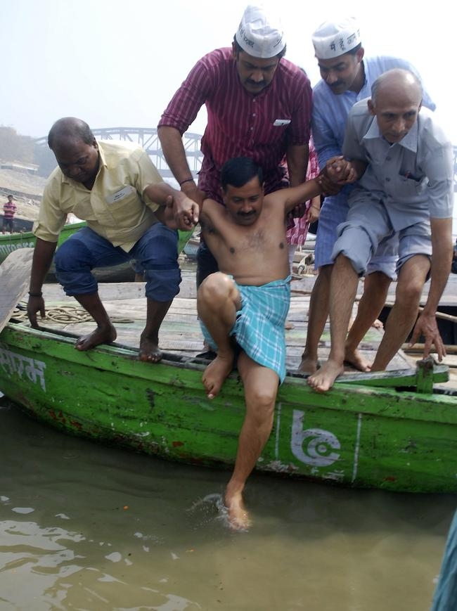 Kejriwal Takes Holy Dip In Varanasi Pics