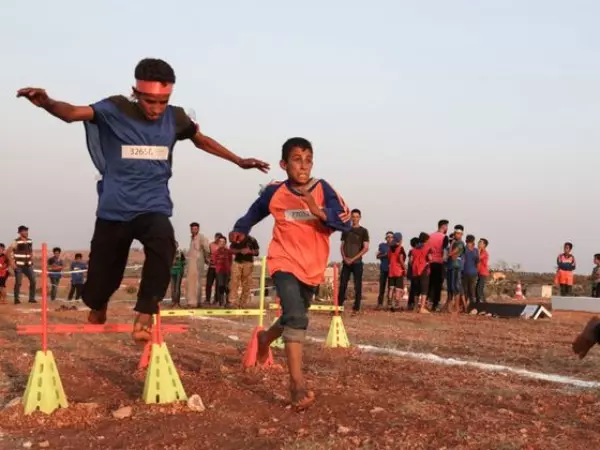 Displaced Syrian boys take part in the so-called 'Camp Olympics 2020' in the town of Fuaa