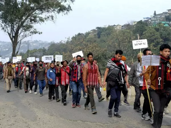 Hundreds of people walked over 40 miles on Tuesday in India's northeast to demand the repeal of a controversial act that grants special powers to Indian troops, following a deadly incident last month when soldiers killed over a dozen civilians.