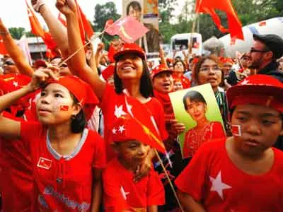 Supporters celebrate Suu Kyi’s landslide win