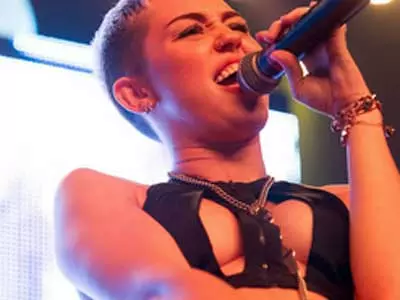 Miley Cyrus goes braless on stage!
