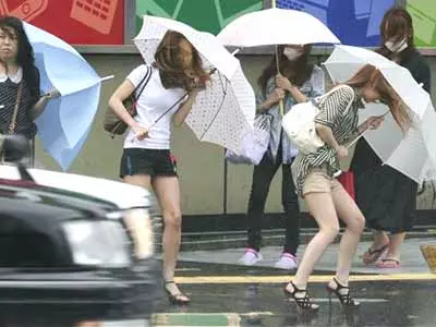 Tropical storms batter Taiwan, Japan