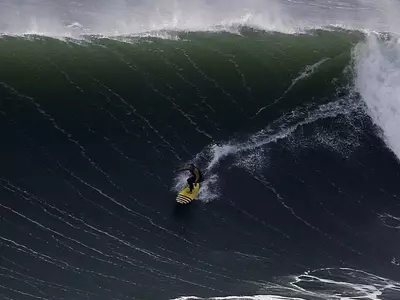 Garrett McNamara Surfing a Big Wave Record