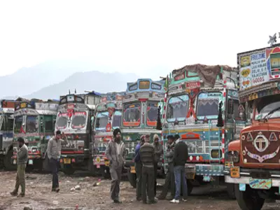 Indian trucks drivers wait for reopening of the LoC
