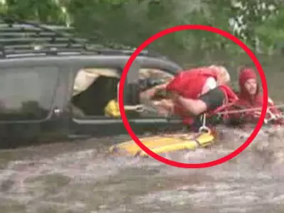 Crew Rescues Girl From Flooded SUV