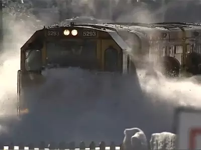 Train Moving Through Deep Snow