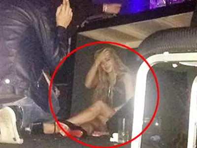 ndsay Lohan Hides Under Table at Brazilian Nightclub