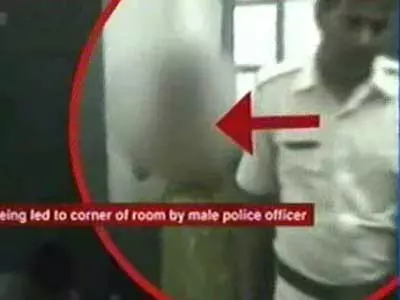 Policemen Strip Woman